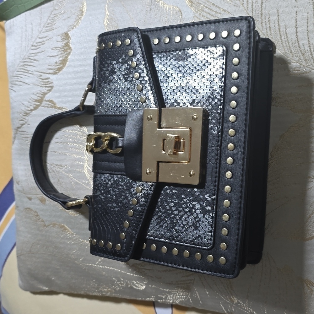 Women's studded gold black snake skin handbag
